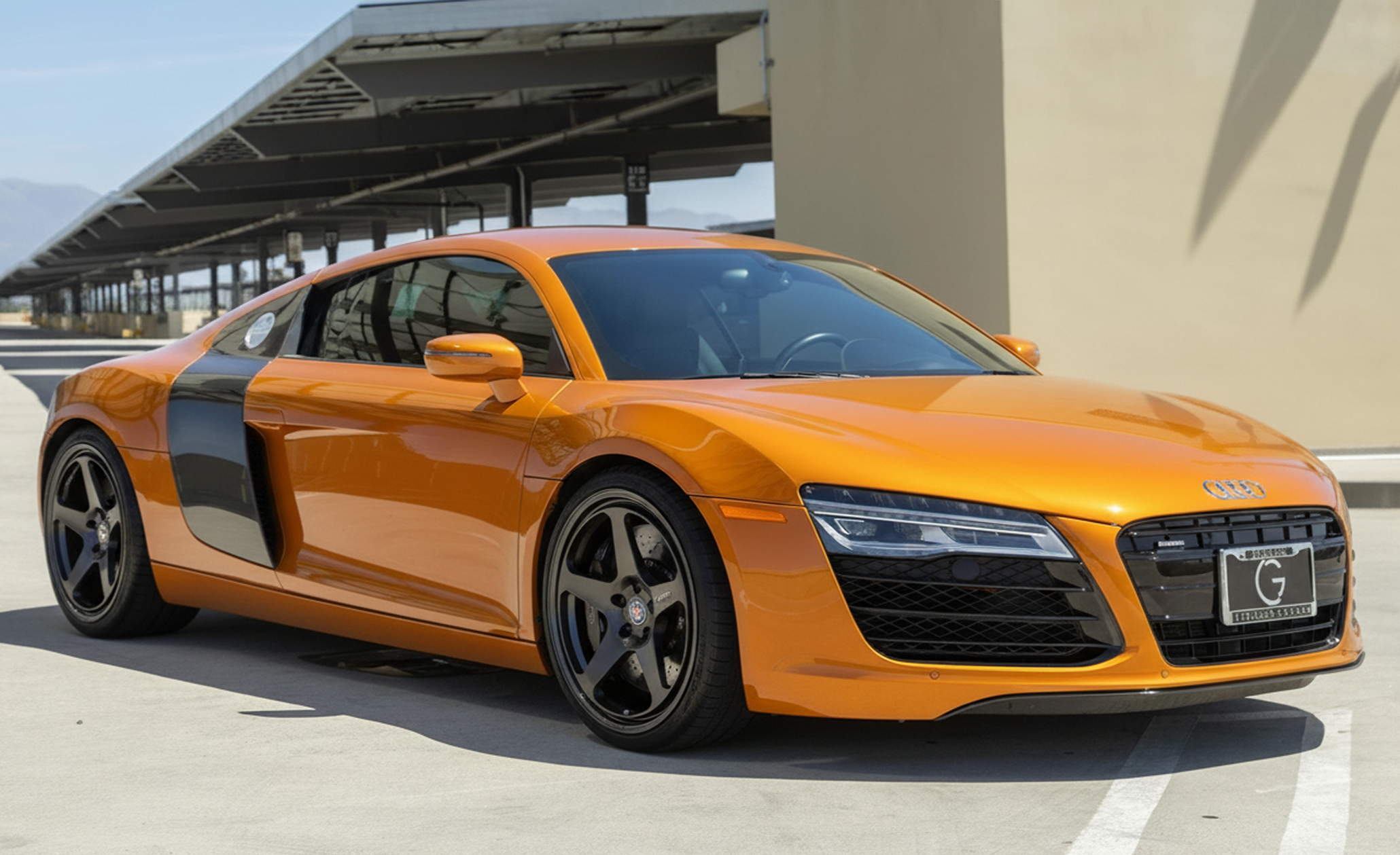 Custom black aftermarket rims on Orange Audi R8 - professional AI wheel render